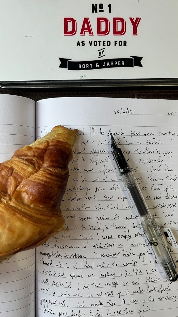 A patchy ink flow, a Prét a Manger croissant and a pen tin that says No. 1 Daddy as voted for by Rory and Jasper